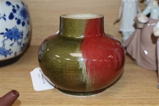 A Chinese squat baluster vase, crackle-glazed in green and red, a blue and white ginger jar and cover and a redware teapot